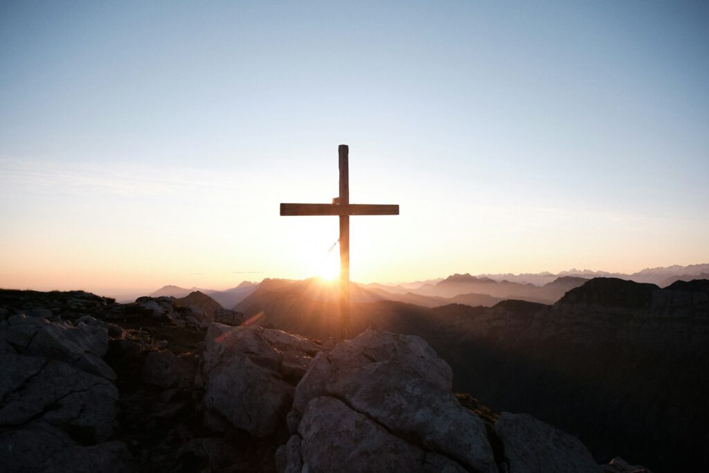 Cross standing on a rock – a firm foundation of faith