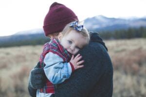 Father hugging his young daughter