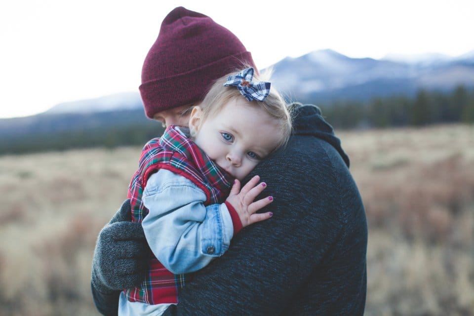 Father hugging his young daughter