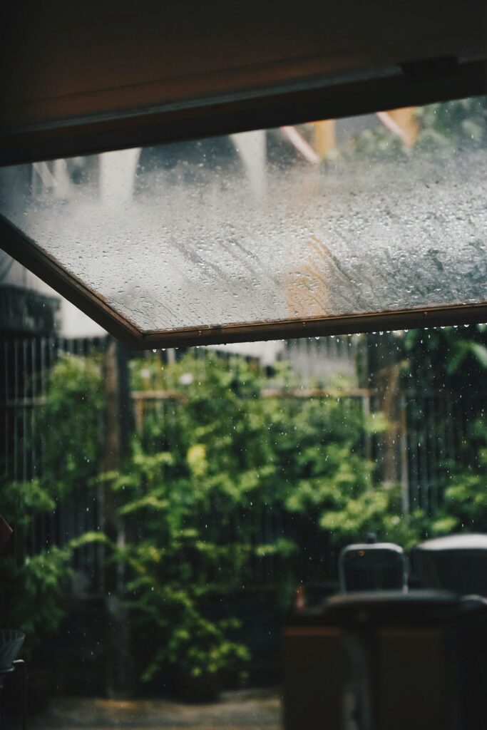Rain drops on window glass – quiet reflection on mental health